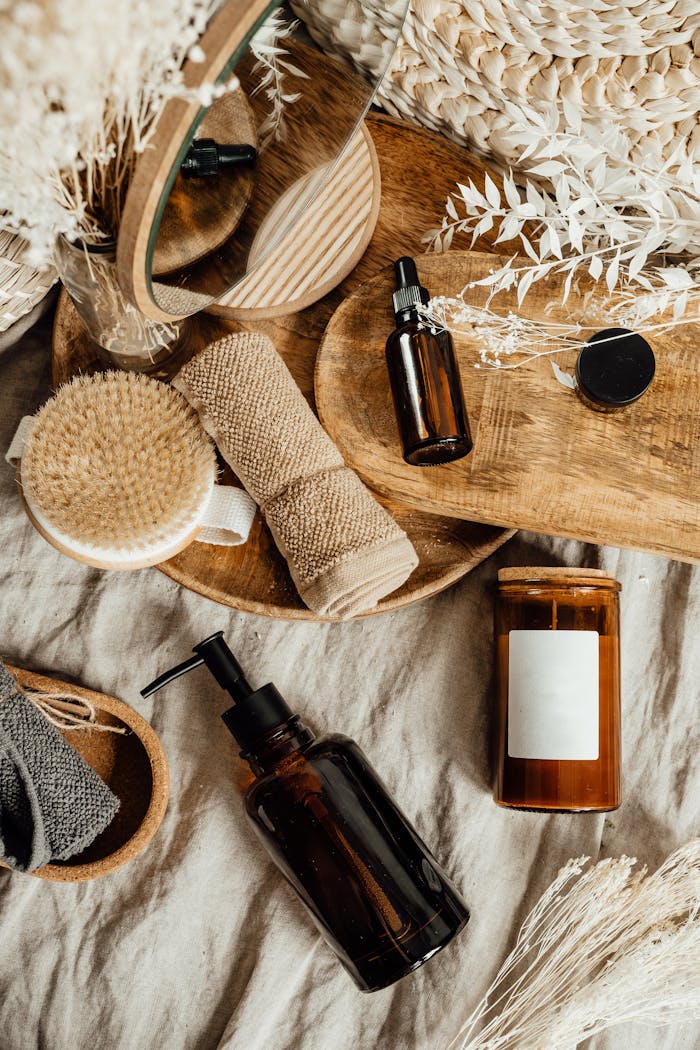 Aesthetic arrangement of natural skincare products and accessories on a wooden tray.